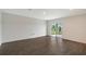 Spacious living room with sliding glass doors, offering abundant natural light and a seamless transition to outdoor living at 13117 Bayberry Way, Parrish, FL 34219