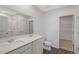 Modern bathroom features double sinks, white cabinetry, a large mirror, and a separate shower area at 13136 Bayberry Way, Parrish, FL 34219