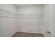 Spacious walk-in closet with wire shelving and neutral carpeting for organized storage at 13136 Bayberry Way, Parrish, FL 34219