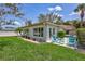 Lush, green backyard with lawn and patio, ideal for outdoor relaxation and entertaining at 139 Vista Hermosa Circle, Sarasota, FL 34242
