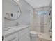 Bathroom featuring a sleek glass shower, modern fixtures, and a stylish marble-top vanity and sink at 139 Vista Hermosa Circle, Sarasota, FL 34242