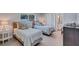 Charming bedroom features two twin beds with decorative pillows and a bedside table with lamp at 139 Vista Hermosa Circle, Sarasota, FL 34242