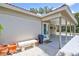 Covered entryway featuring pillars, double doors, and tiled flooring, offering a welcoming entrance at 139 Vista Hermosa Circle, Sarasota, FL 34242