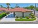 Charming single-story villa with a red tile roof, carport, and well-maintained landscaping at 139 Vista Hermosa Circle, Sarasota, FL 34242