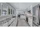 Spacious open-concept kitchen and living area with granite counters and stainless steel appliances at 139 Vista Hermosa Circle, Sarasota, FL 34242