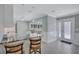 Bright kitchen with granite countertops, stainless appliances, and pendant lighting at 139 Vista Hermosa Circle, Sarasota, FL 34242