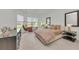 This bright bedroom features two large windows, a hanging chair, and modern furnishings at 15315 Derna Ter, Bradenton, FL 34211