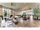 Inviting community room with comfortable seating, large windows, and stylish decor, creating a perfect space for relaxation at 15315 Derna Ter, Bradenton, FL 34211