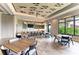Spacious community room featuring a kitchenette, tables, and chairs, ideal for gatherings and events at 15315 Derna Ter, Bradenton, FL 34211
