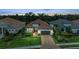 Charming single-Gathering home features a well-manicured lawn and paver driveway at 15315 Derna Ter, Bradenton, FL 34211
