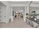 Open foyer featuring elegant columns, tile flooring, and views into the dining and living areas at 15315 Derna Ter, Bradenton, FL 34211
