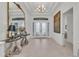 Spacious foyer featuring high ceilings, a decorative mirror, and tiled flooring at 15315 Derna Ter, Bradenton, FL 34211