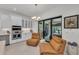 Cozy nook in the kitchen featuring comfortable seating, a stylish chandelier, and easy access to outdoor views at 15315 Derna Ter, Bradenton, FL 34211
