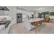 Spacious white kitchen with a large island, stainless steel appliances, and ample counter space at 15315 Derna Ter, Bradenton, FL 34211