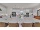 Large kitchen island with seating, modern appliances, and white cabinetry at 15315 Derna Ter, Bradenton, FL 34211