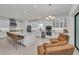 Elegant white kitchen with an island, modern appliances, and an inviting seating area at 15315 Derna Ter, Bradenton, FL 34211