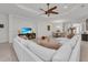 Bright living room with a modern sofa, stylish decor, and an adjacent dining area, perfect for entertaining guests at 15315 Derna Ter, Bradenton, FL 34211