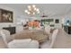 Dining area featuring a round table, seating for six, and views into the living room at 15315 Derna Ter, Bradenton, FL 34211