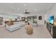 Open-concept living area featuring a large sectional sofa and seamless flow to the kitchen at 15315 Derna Ter, Bradenton, FL 34211