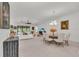 Spacious living area with tile flooring, modern furniture, and access to the outdoor pool area at 15315 Derna Ter, Bradenton, FL 34211