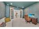 This view of the office shows the tiled flooring and french doors with views into the entryway at 15315 Derna Ter, Bradenton, FL 34211