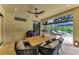 Screened-in patio featuring a dining area and views of the pool and backyard at 15315 Derna Ter, Bradenton, FL 34211