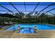 Screened-in pool area with an in-ground spa and lounge chairs, surrounded by lush greenery at 15315 Derna Ter, Bradenton, FL 34211