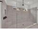 Large, modern shower with tile walls, glass doors, and bronze fixtures at 15315 Derna Ter, Bradenton, FL 34211