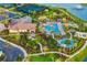 Community aerial shot features clubhouse, pool, spa and outdoor grill areas with landscaping and parking at 17128 Ranchside Pl, Lakewood Ranch, FL 34211