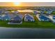 Aerial view of several waterfront homes with screened in patios in a planned community at 17128 Ranchside Pl, Lakewood Ranch, FL 34211