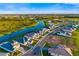 Aerial view showcases a new construction neighborhood featuring multiple waterways and landscaping at 17128 Ranchside Pl, Lakewood Ranch, FL 34211