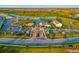 Wide aerial shot of the community, showcasing the manicured landscaping, attractive clubhouse, and convenient parking areas at 17128 Ranchside Pl, Lakewood Ranch, FL 34211