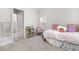 Bright and inviting bedroom featuring plush carpeting, storage space, and lots of natural light at 17128 Ranchside Pl, Lakewood Ranch, FL 34211