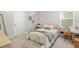 Bright bedroom with carpet, a comfortable bed, and a charming decor at 17128 Ranchside Pl, Lakewood Ranch, FL 34211