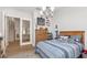 Bedroom featuring a bed with striped blanket, and memorabilia at 17128 Ranchside Pl, Lakewood Ranch, FL 34211