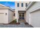 Inviting entrance with double doors, decorative wreaths, and a paved walkway leading to the home at 17128 Ranchside Pl, Lakewood Ranch, FL 34211