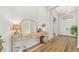 Bright foyer with console table, mirror, and light hardwood flooring at 17128 Ranchside Pl, Lakewood Ranch, FL 34211