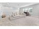 Spacious living room with plush seating and natural light from multiple windows at 17128 Ranchside Pl, Lakewood Ranch, FL 34211