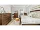Beautiful bedroom with tray ceilings, detailed trim and baseboards, and lots of storage at 17128 Ranchside Pl, Lakewood Ranch, FL 34211