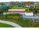 Landscaped community sign reading 'Star Farms at Lakewood Ranch' with manicured gardens and a tranquil water feature at 17128 Ranchside Pl, Lakewood Ranch, FL 34211