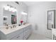 Spacious bathroom features double sinks, ample cabinet space, and white finishes for a clean look at 1871 Prospect St, Sarasota, FL 34239
