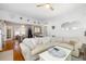 Inviting living room showcasing hardwood floors, a comfortable sofa, and open access to the dining area at 1871 Prospect St, Sarasota, FL 34239