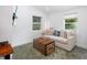 Relaxing living room with comfortable sofa, wooden chest coffee table, and natural light at 1871 Prospect St, Sarasota, FL 34239