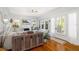 Sunlit living room with fireplace, hardwood floors, and access to outdoor living space at 1871 Prospect St, Sarasota, FL 34239