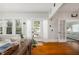 Inviting living room with bright windows, wood flooring, and casual, comfortable decor at 1871 Prospect St, Sarasota, FL 34239