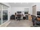 Spacious office with dual desks, ergonomic chairs and sliding glass doors to the outside at 1871 Prospect St, Sarasota, FL 34239