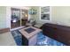 Comfortable screened porch with outdoor seating and a fire pit table at 1871 Prospect St, Sarasota, FL 34239