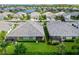 Aerial view showing well maintained homes with lush greenery and a peaceful backyard patio environment at 2070 Crystal Lake Trl, Bradenton, FL 34211
