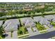 Aerial view showcasing the home's location within a well-maintained neighborhood with a lake view at 2070 Crystal Lake Trl, Bradenton, FL 34211