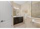 Bathroom featuring a vanity with a granite countertop, modern lighting, and glass shower at 2070 Crystal Lake Trl, Bradenton, FL 34211